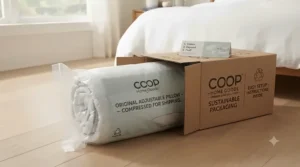View of the compressed, sustainable packaging used for shipping the Coop Home Goods pillow.