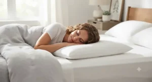 An ultra-slim pillow positioned on a bed specifically for comfortable stomach sleeping.