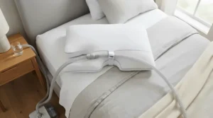 Demonstrating hose clearance on a CPAP pillow for stomach sleepers